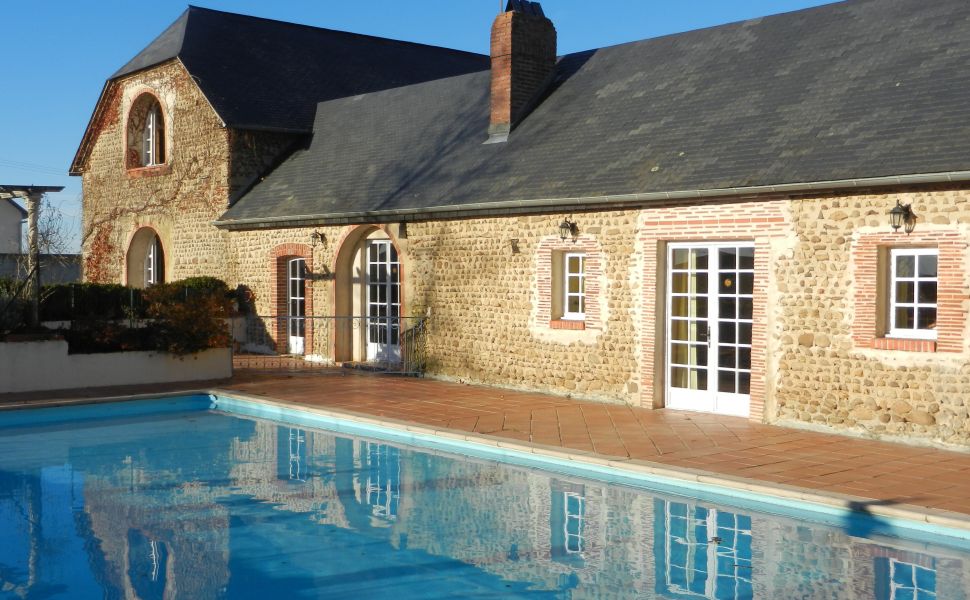 An Attractive Courtyard Farmhouse with Guest Cottage, Swimming Pool and Mountain Views