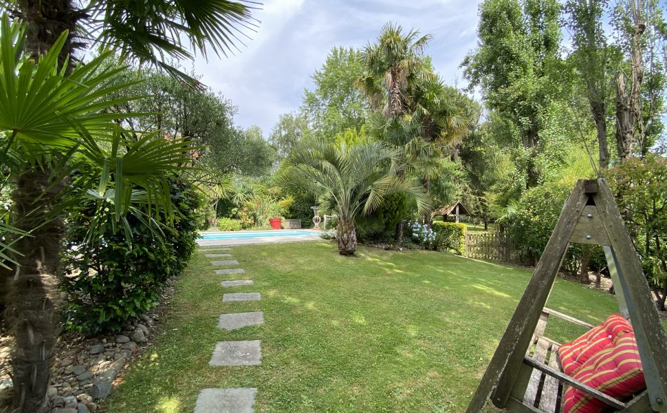 A Beautiful Contemporary Property with Charming Flowery Gardens in Heart of a Lovely Landaise Town