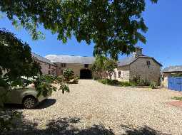 An Attractive Courtyard Farmhouse with Guest Cottage, Swimming Pool and Mountain Views