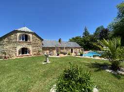 An Attractive Courtyard Farmhouse with Guest Cottage, Swimming Pool and Mountain Views