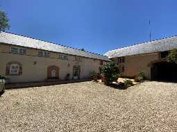 An Attractive Courtyard Farmhouse with Guest Cottage, Swimming Pool and Mountain Views