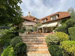 A Beautiful Contemporary Property with Charming Flowery Gardens in Heart of a Lovely Landaise Town