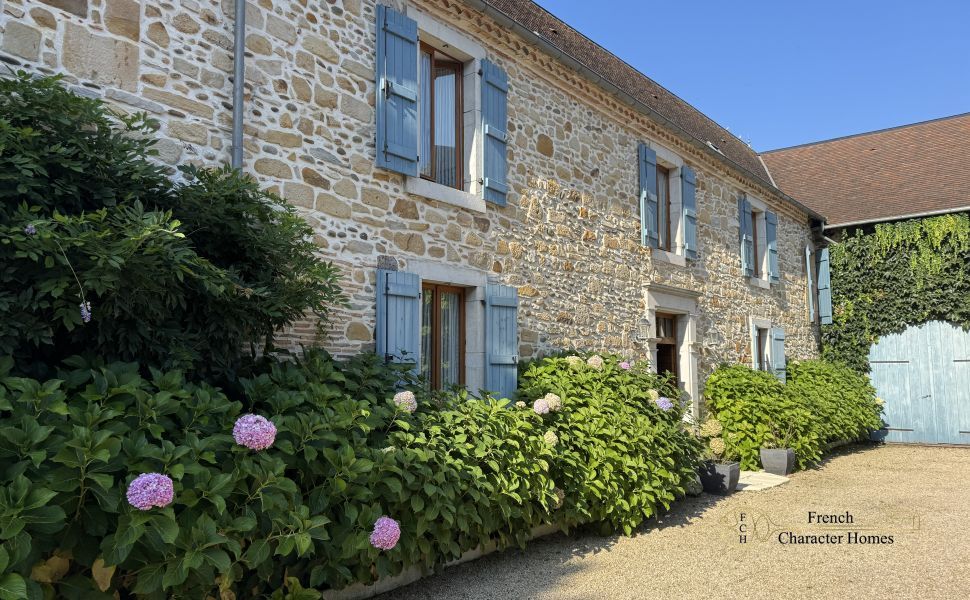 Charming Béarnaise Farmstead with Renovated Home, Barns & Gîte Potential 
