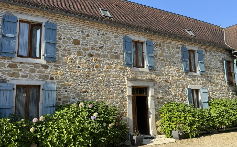 Charming Béarnaise Farmstead with Renovated Home, Barns & Gîte Potential 