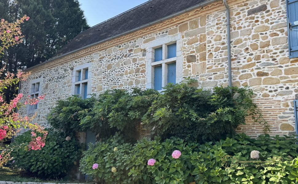 Charming Béarnaise Farmstead with Renovated Home, Barns & Gîte Potential 