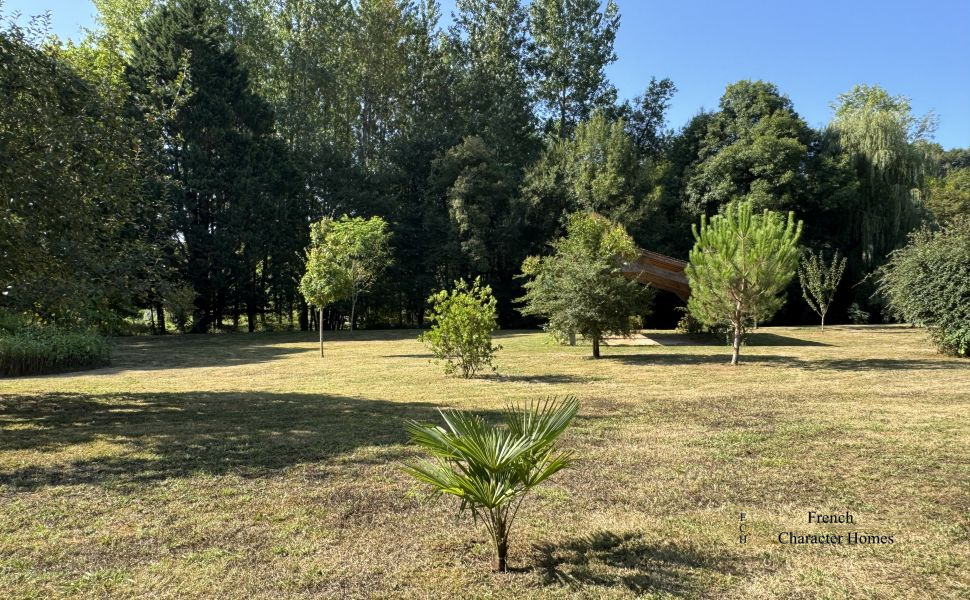 Charming Béarnaise Farmstead with Renovated Home, Barns & Gîte Potential 