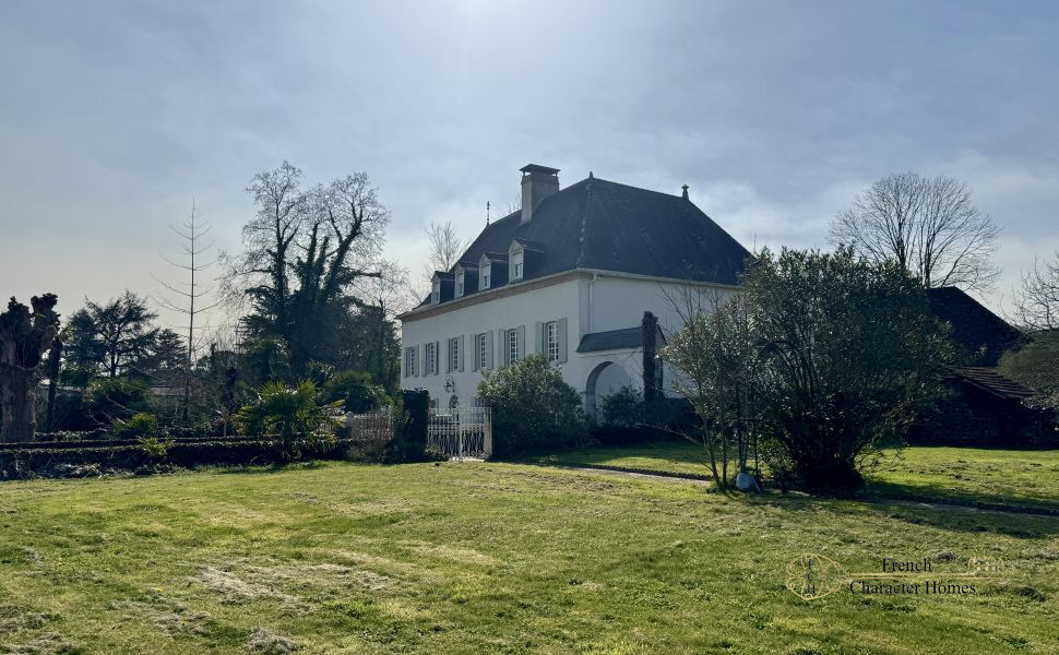 Substantial Village Manor House with River Frontage